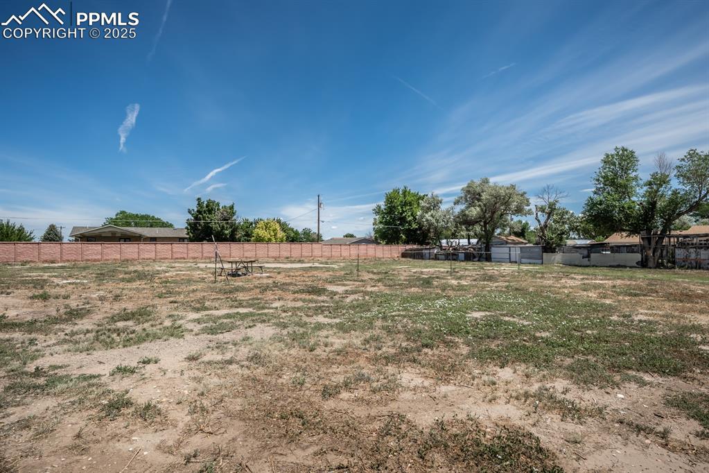 Image 49 of 50: View of front of home featuring a garage and stucco siding