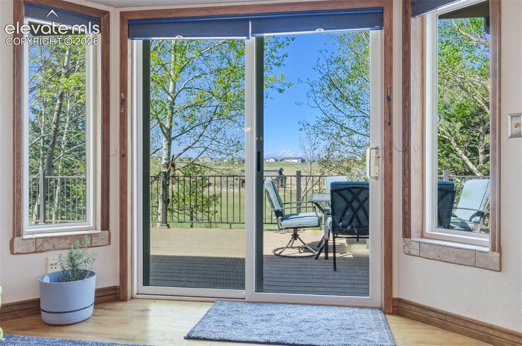 Image 15 of 50: Walk Out from Living Room onto Back Deck