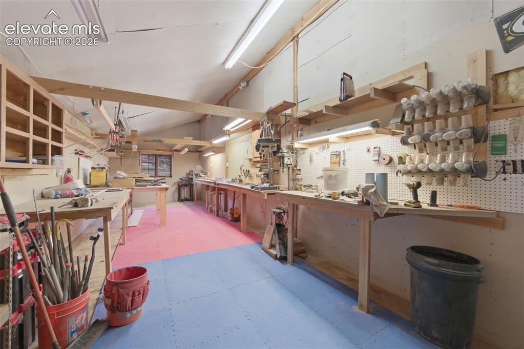 Image 45 of 50: Workshop in 3 Car Garage