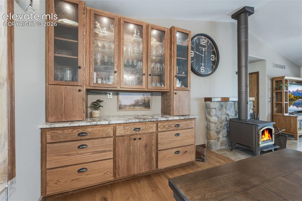 Image 7 of 50: Built In Hutch and Wood Burning Stove