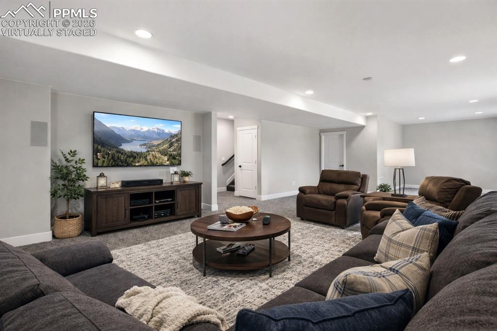 Image 24 of 41: Basement Family/Rec room Virtually Staged