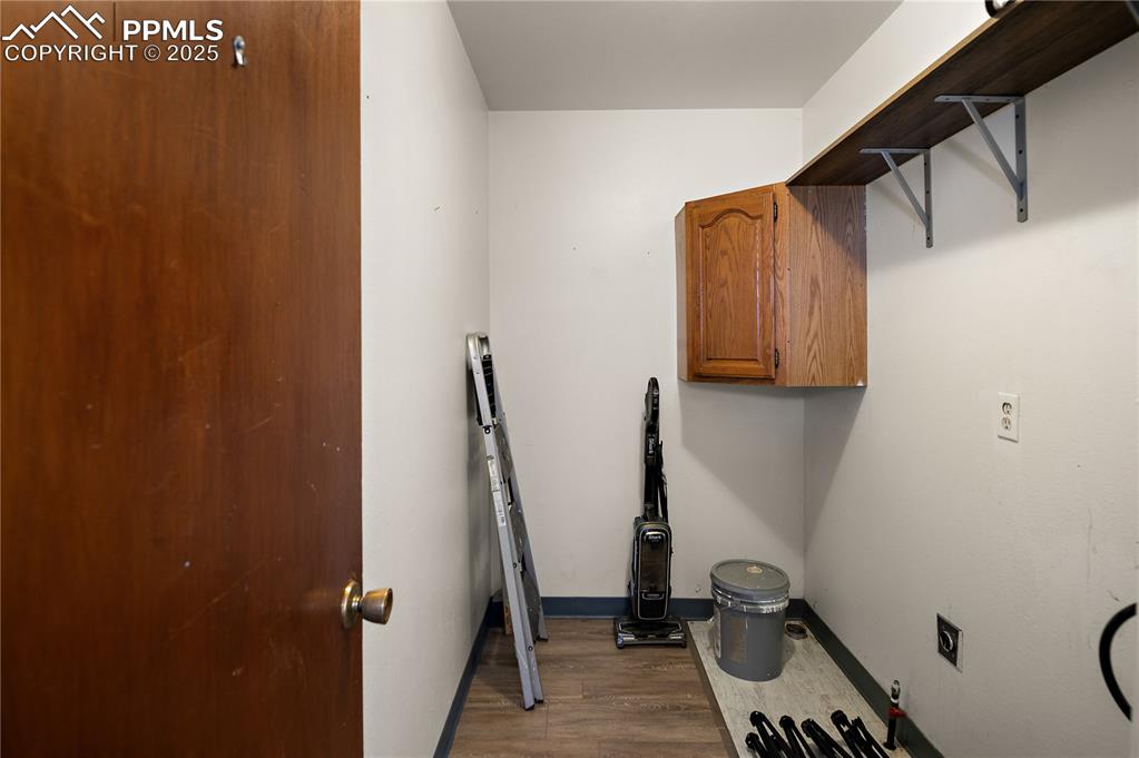 Image 13 of 25: Laundry Area Offers Electric & Gas Hook-ups Plus Additional Storage Space