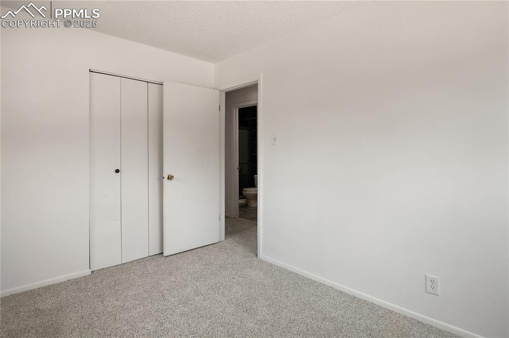 Image 18 of 25: Both Bedrooms are Adjacent to the Updated Bathroom