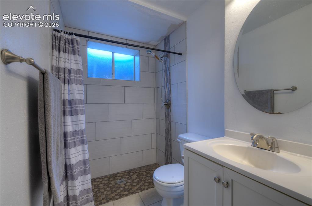 Image 14 of 26: Basement bath