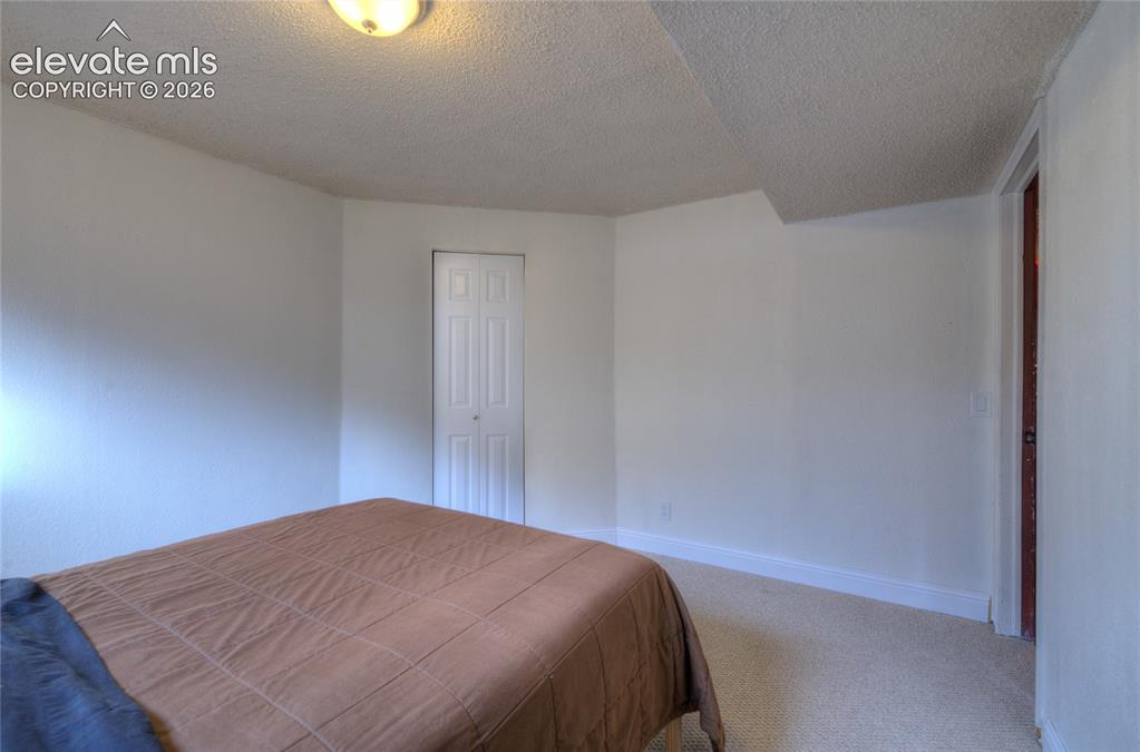 Image 18 of 26: Basement bedroom 4
