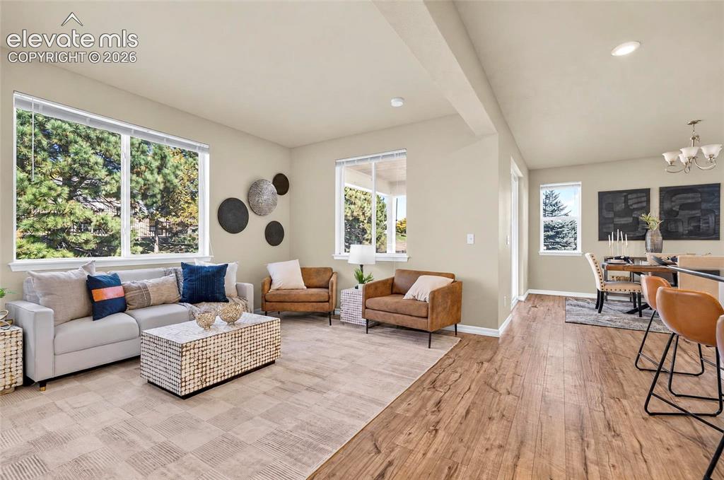 Image 12 of 41: Open-concept living space with abundant natural light, recessed lighting, a