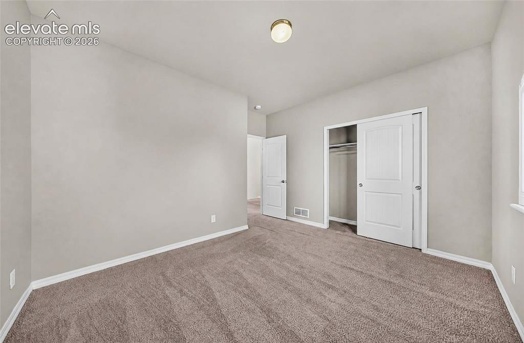 Image 30 of 41: Neutral wall paint with white trim