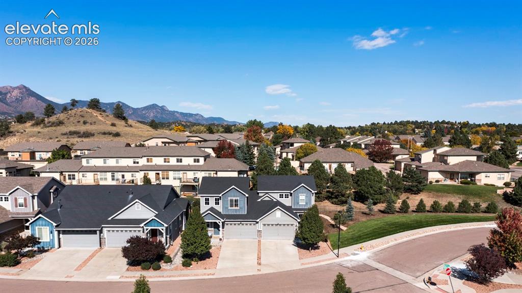 Image 37 of 41: Residential neighborhood featuring varied architectural styles, paved stree