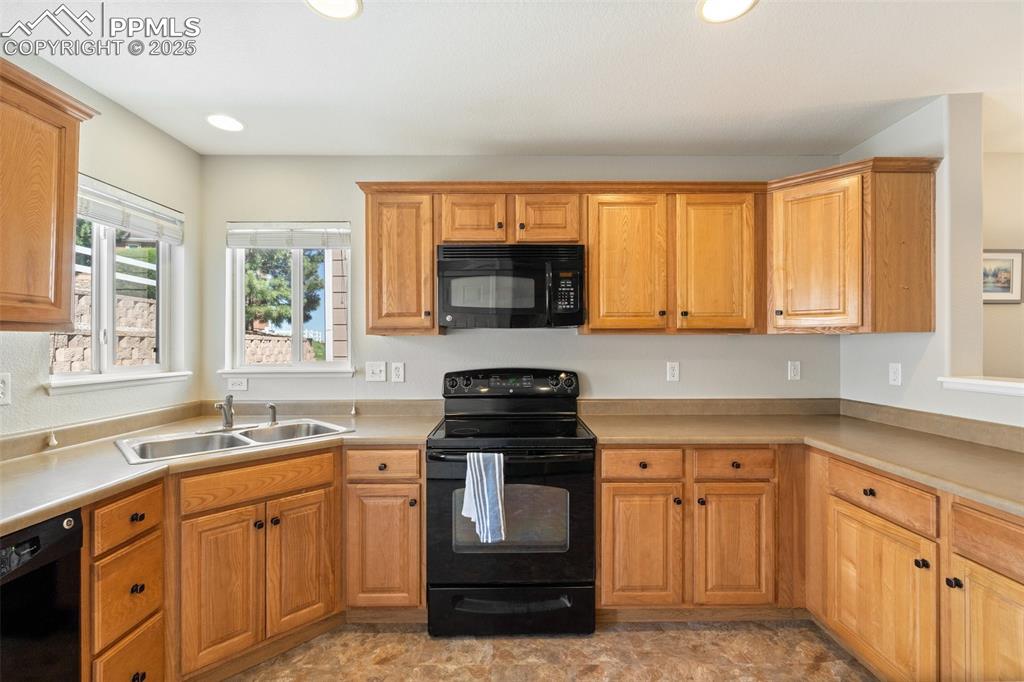 Image 10 of 38: Great amount of cabinet storage and countertop space