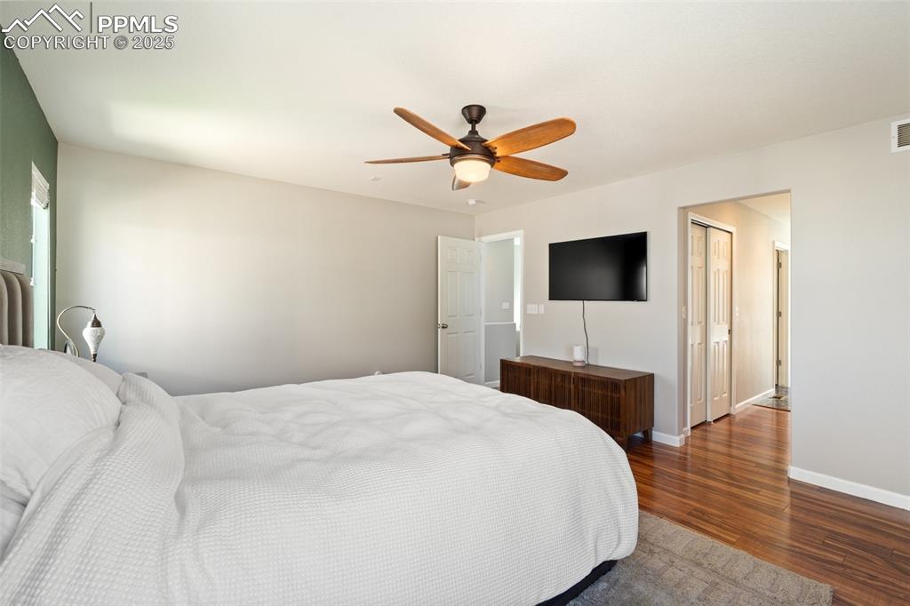 Image 23 of 38: Upper level primary bedroom has an adjoining bath with double closets