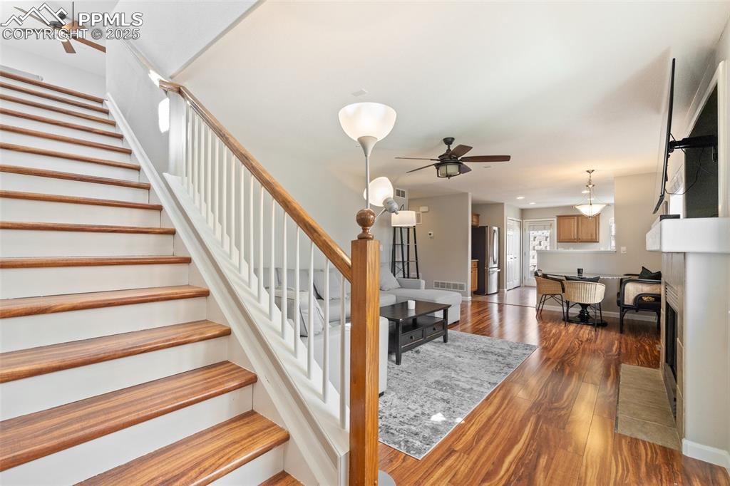 Image 3 of 38: Front entry with a closet opens up to the main level living room