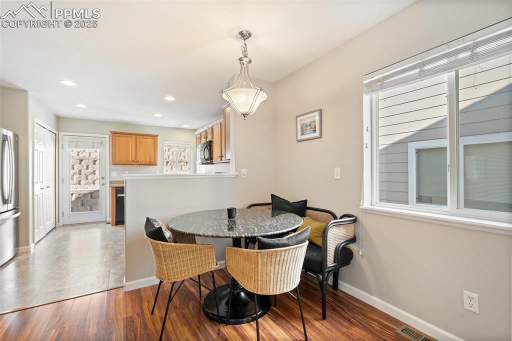 Image 7 of 38: Living and dining space lead into the kitchen