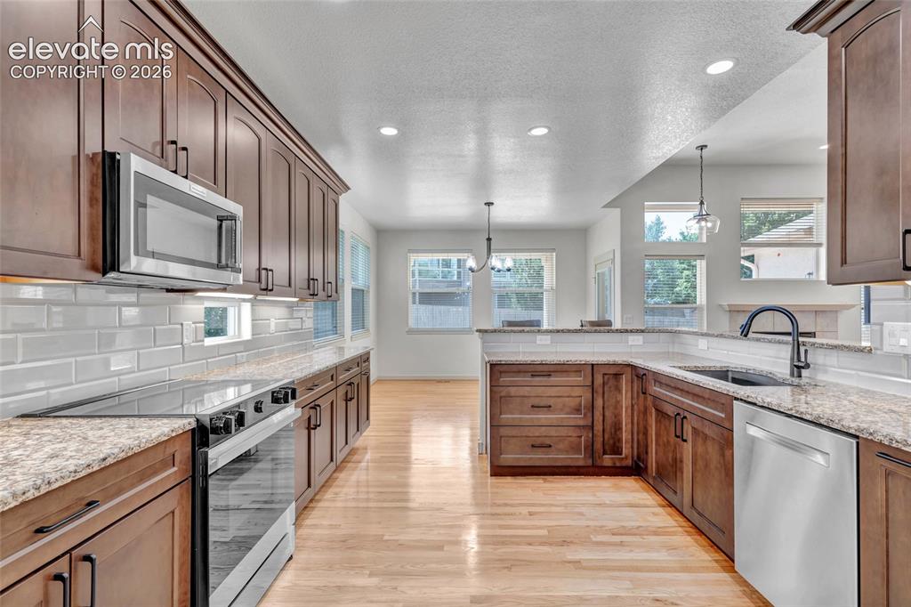 Image 17 of 50: Kitchen with smart range/oven