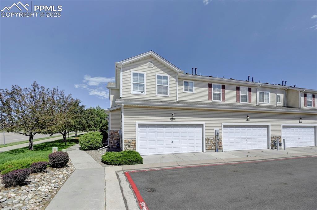 Image 14 of 31: View of front of property with stone siding