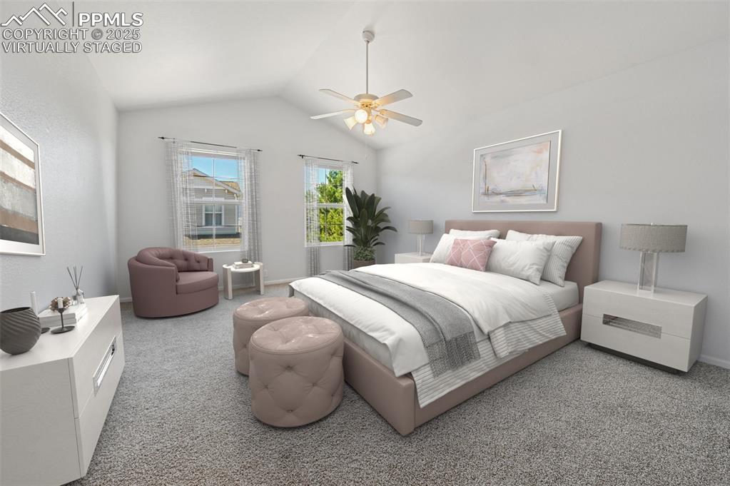 Image 5 of 31: Bedroom featuring lofted ceiling, a ceiling fan, and light colored carpet. 