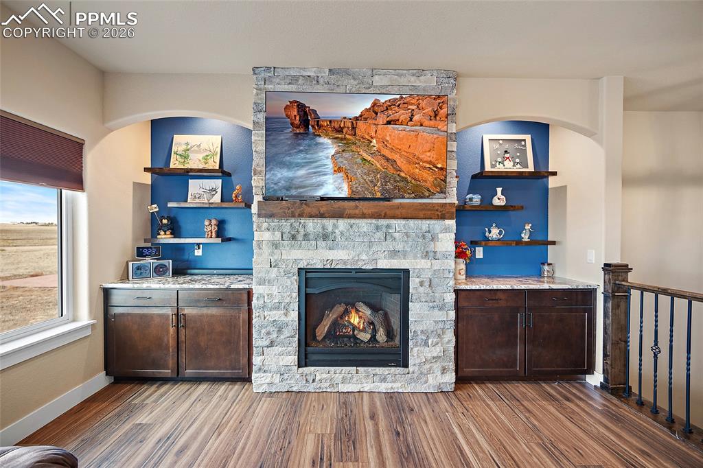 Image 13 of 49: Gas fireplace with built-ins