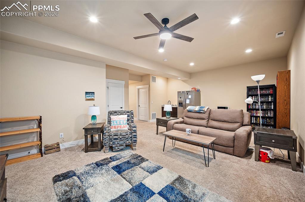 Image 27 of 49: Lower level family room.
