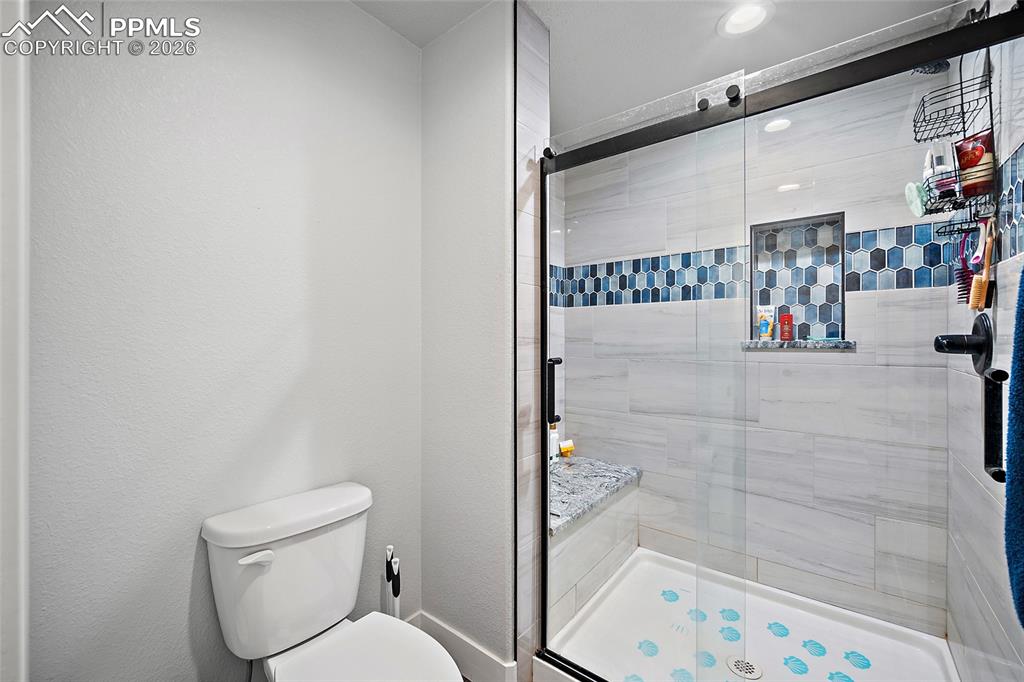 Image 33 of 49: Lower level bathroom shower.