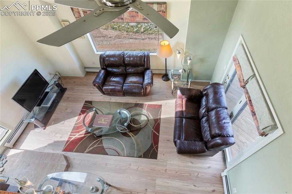 Image 13 of 48: Living room featuring wood finished floors