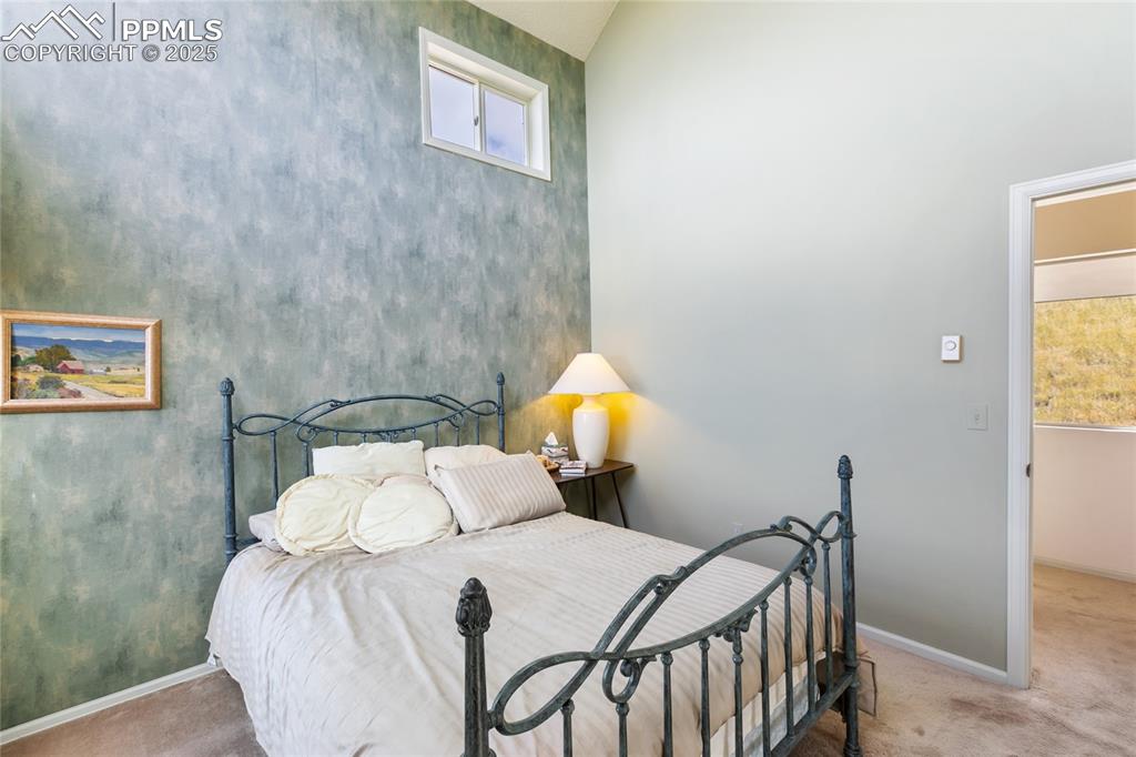 Image 30 of 48: Carpeted bedroom with baseboards