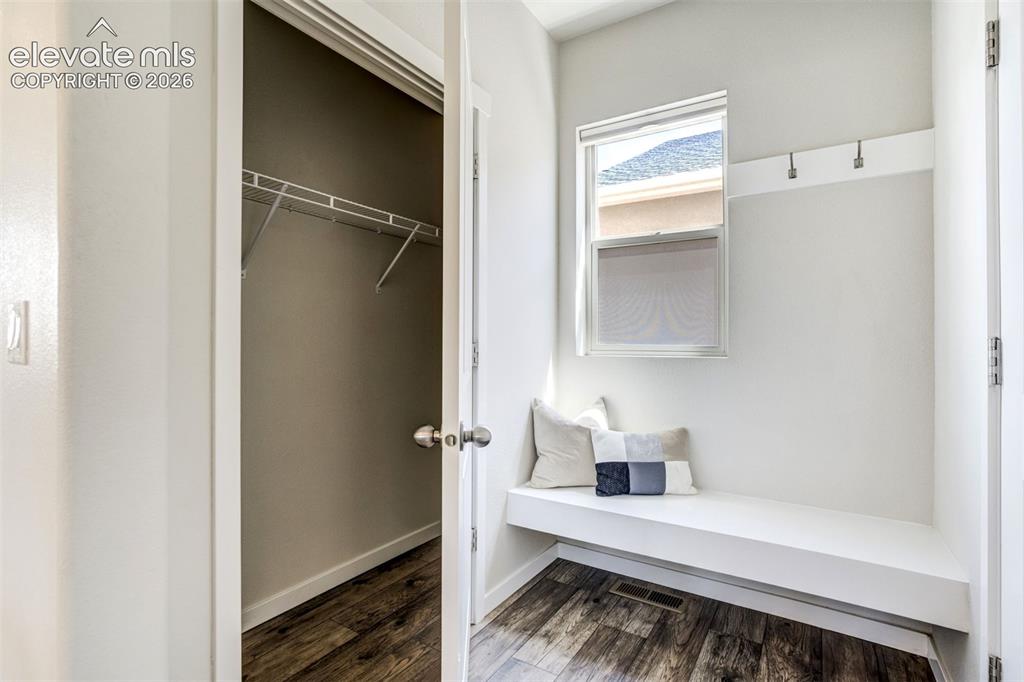 Image 19 of 44: Mud room area by the garage entry with a coat closet.