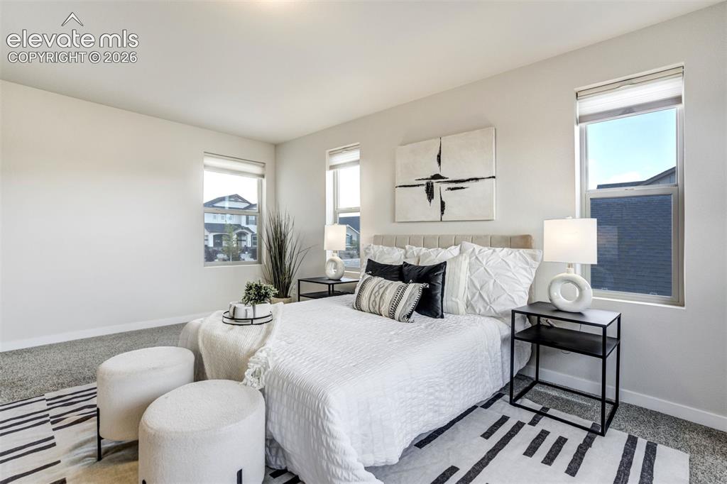 Image 22 of 44: Primary bedroom is spacious & private.