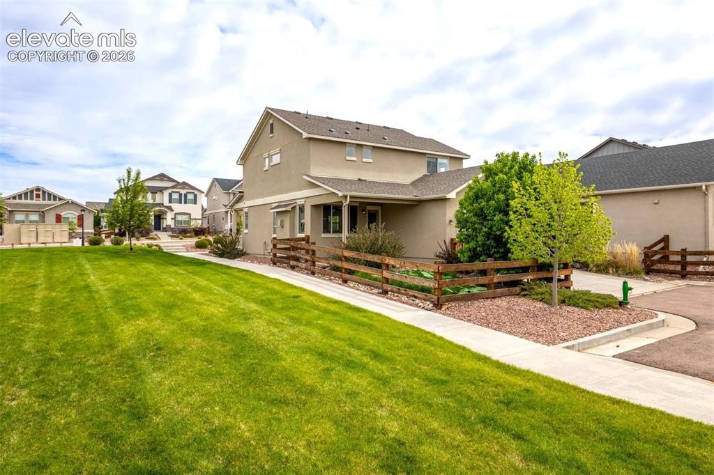 Image 38 of 44: Green space surrounds the property.