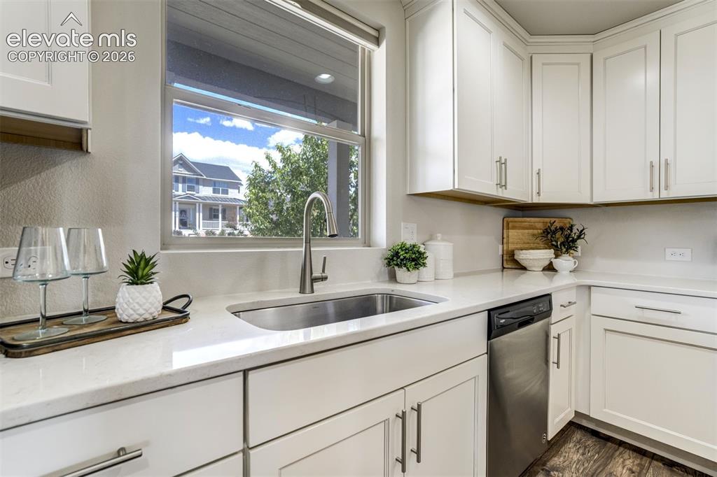 Image 8 of 44: Wash dishes in your single-bowl sink with a view.