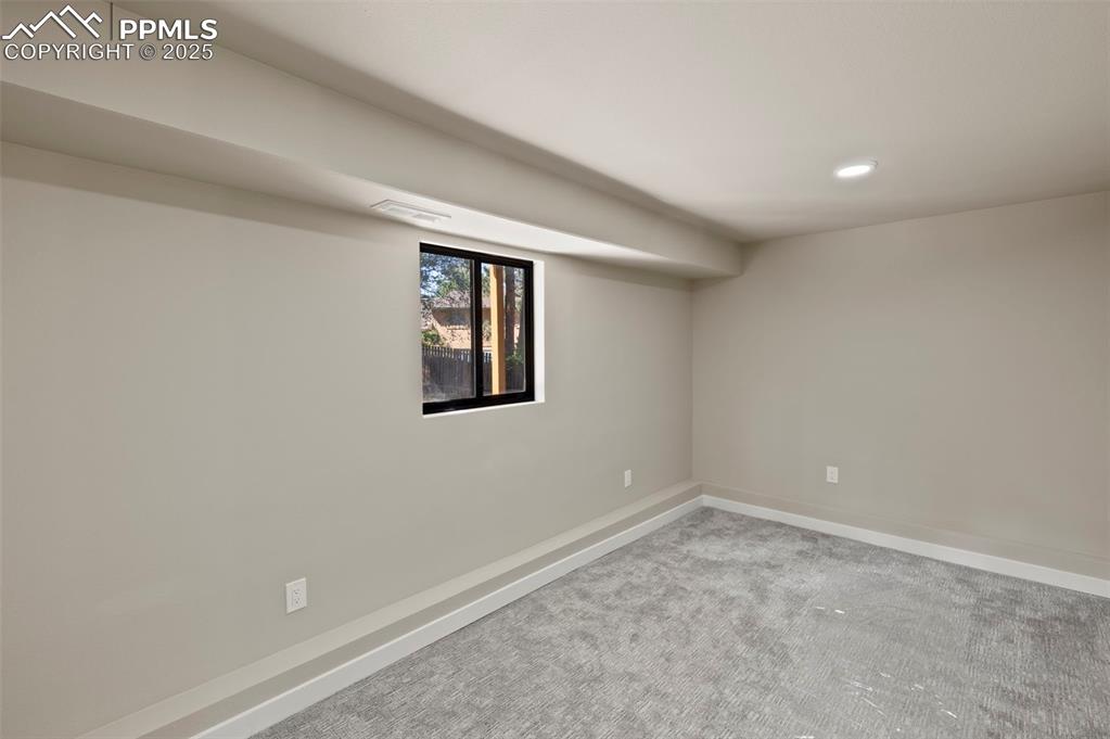 Image 34 of 50: Basement with carpet flooring and recessed lighting