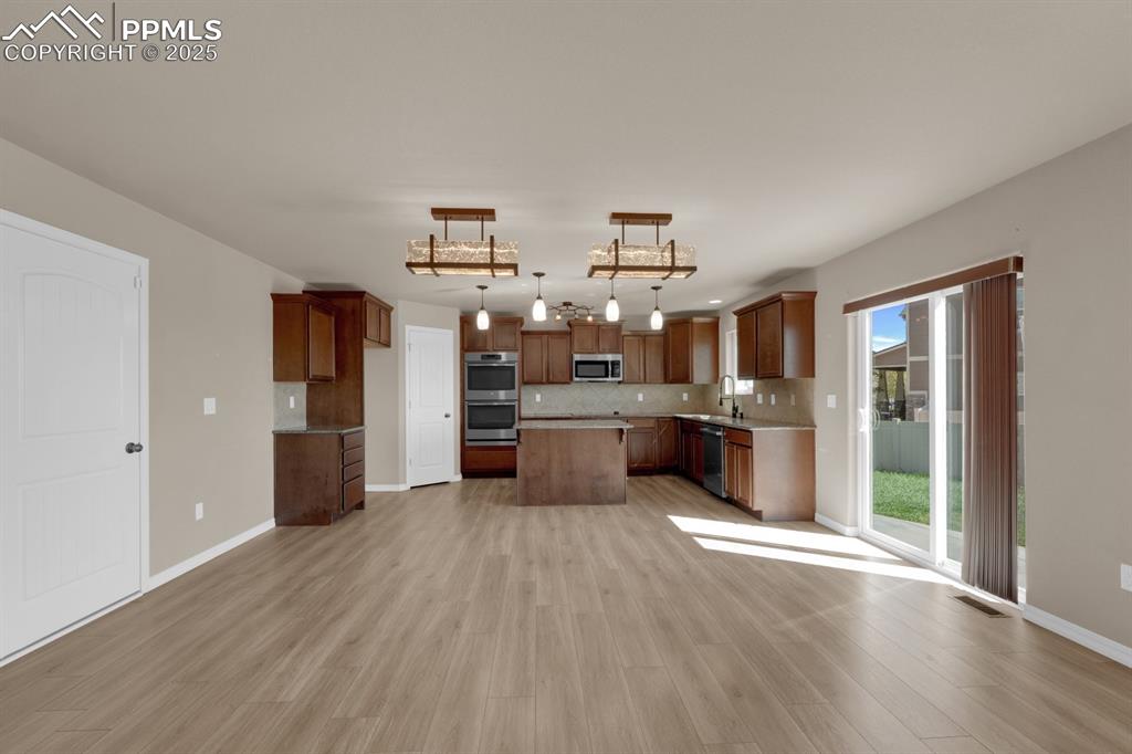 Image 11 of 38: Kitchen featuring walk-out to patio