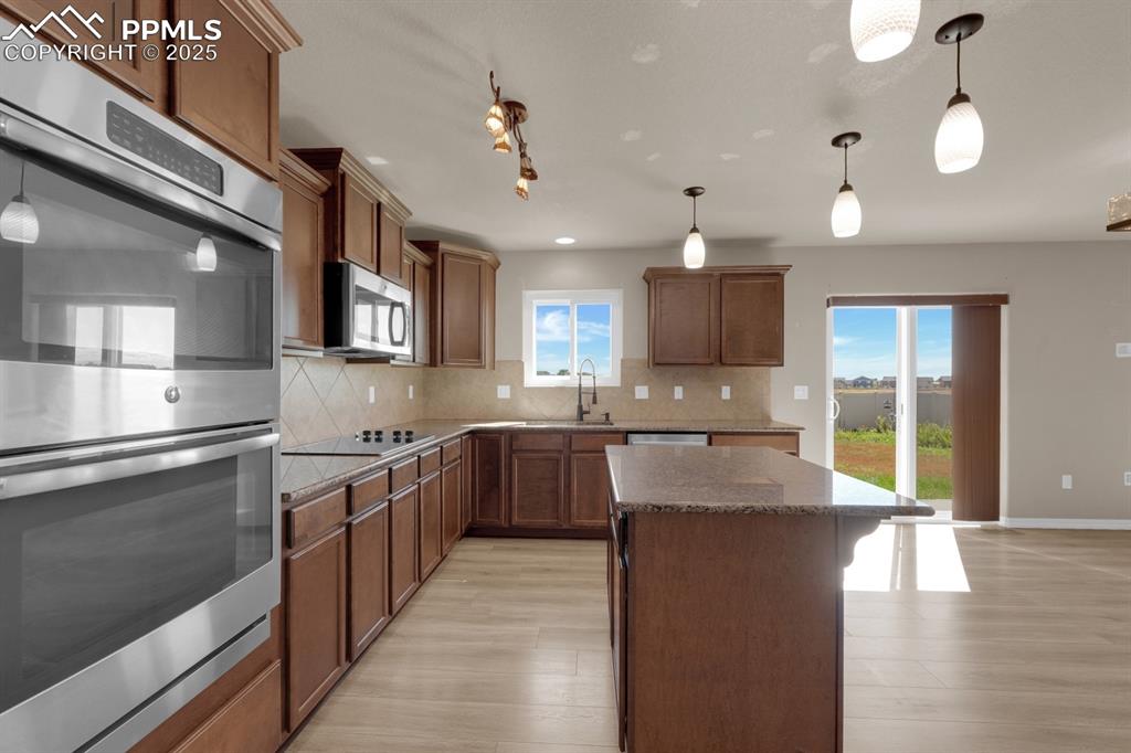 Image 13 of 38: Kitchen with a center island