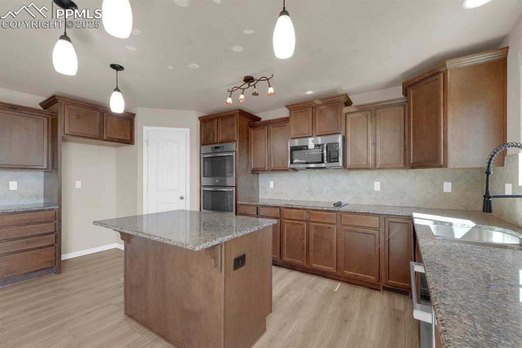 Image 2 of 38: Kitchen featuring large pantry