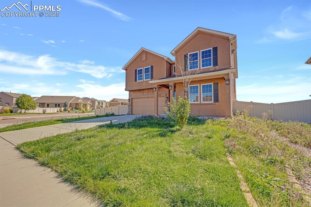 Image 34 of 38: Large front yard on corner lot 