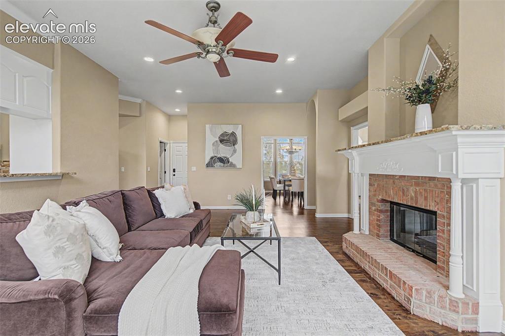 Image 12 of 42: Flowing directly from the kitchen, this relaxing living area emphasizes the