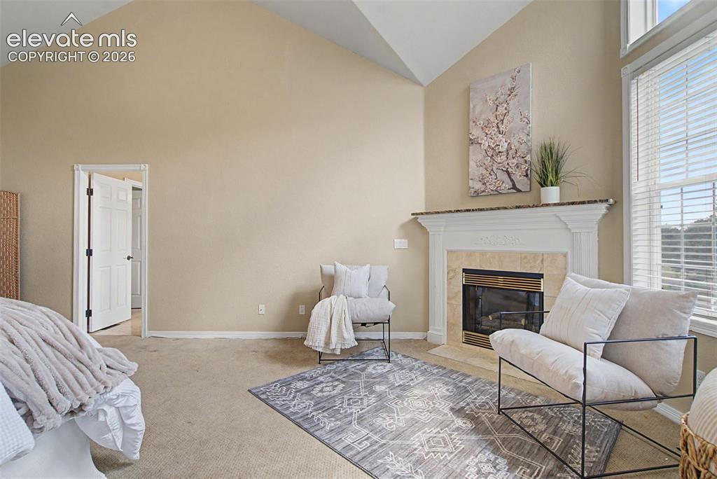 Image 22 of 42: A private gas fireplace makes the primary suite the ultimate cozy sanctuar