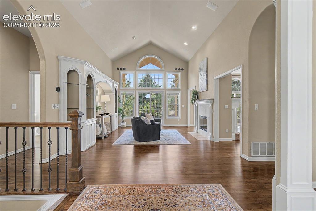 Image 5 of 42: The great room serves as a sophisticated central gathering space, framed by