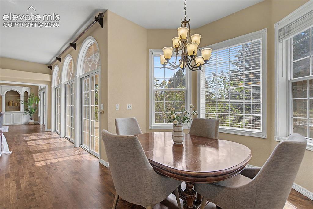 Image 9 of 42: The eat-in breakfast nook offers a serene, sunlit dining experience, entire