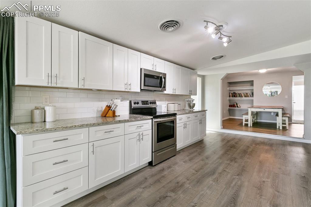 Image 10 of 36: Facing dining room