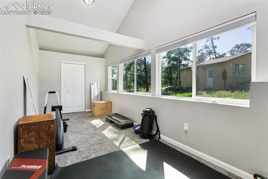 Image 21 of 36: Third bedroom with vaulted ceilings