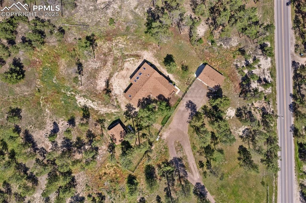 Image 31 of 36: Showing driveway and all three sturctures, Shoup rd on the right