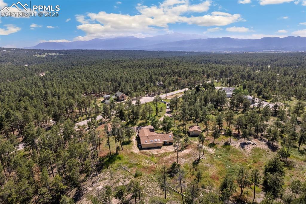 Image 32 of 36: Facing southwest and the rear of the property with mountain views