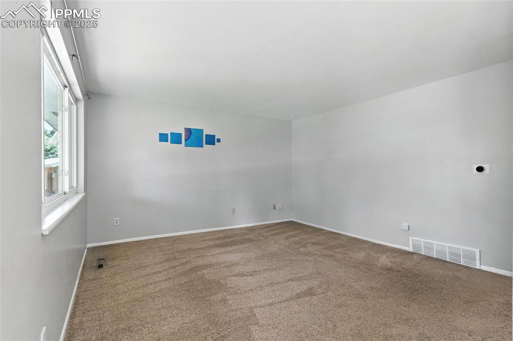Image 14 of 42: Looking into the Living Room from the Front Door