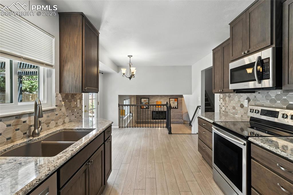 Image 20 of 42: Looking Through the Kitchen to the Family Room