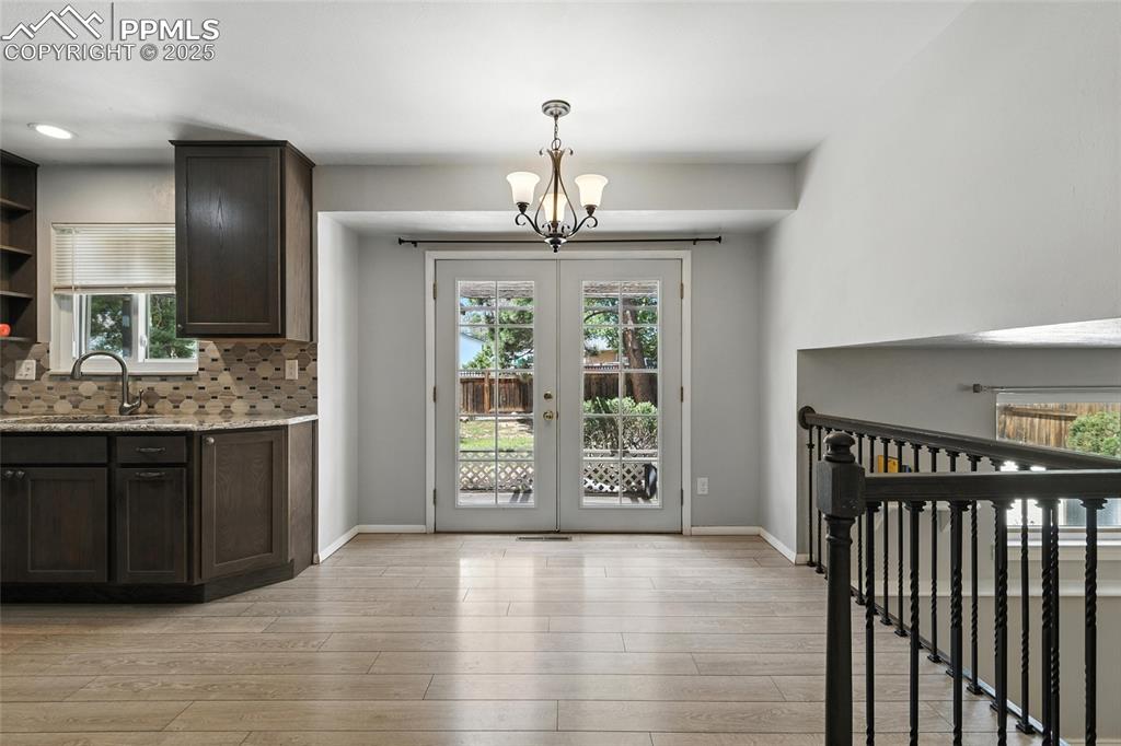 Image 21 of 42: French Doors off of the Dining Area