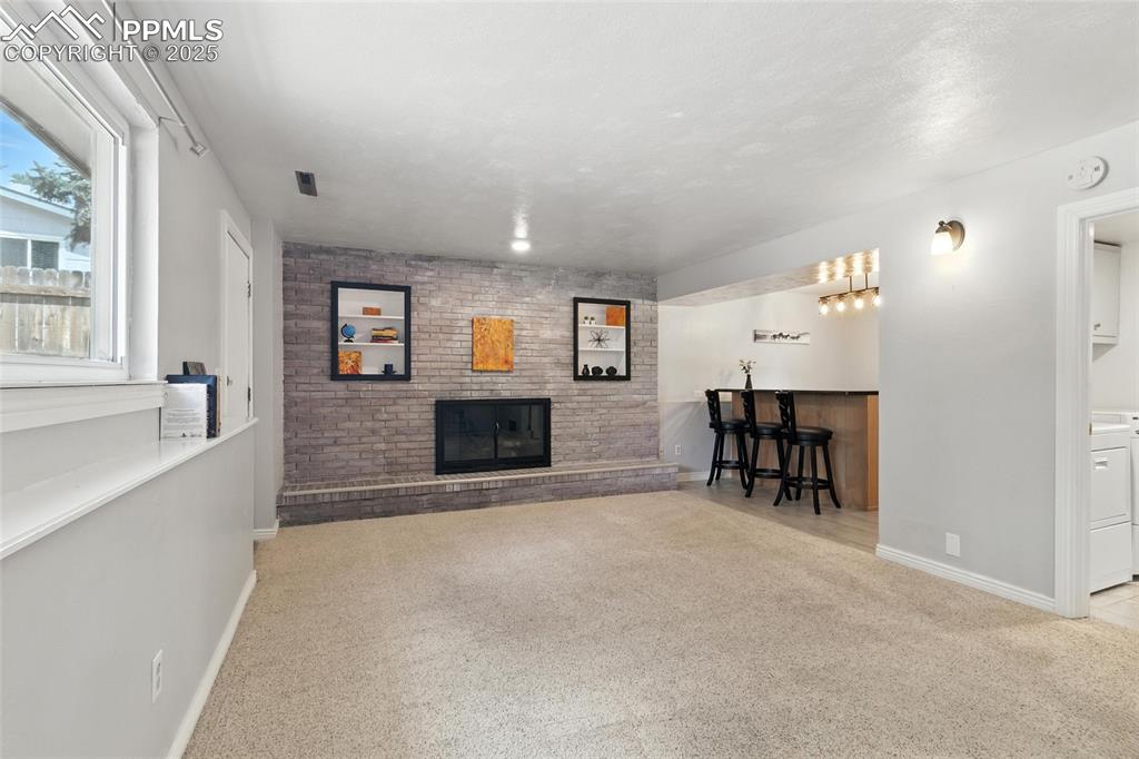 Image 6 of 42: Family Room with Soft Gray Walls.