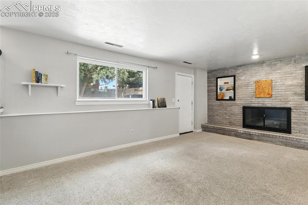 Image 8 of 42: Family Room with Door to the Backyard