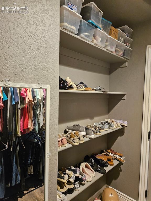 Image 24 of 37: Master walk in closet
