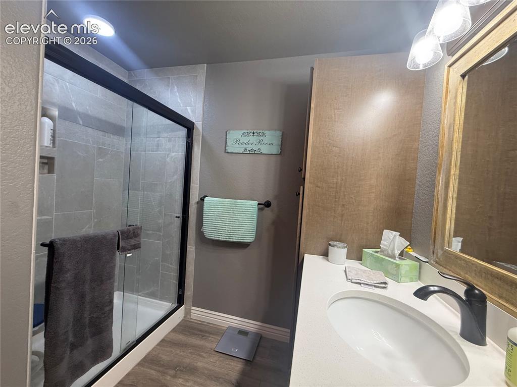 Image 25 of 37: Bathroom off the Master Bedroom with Standing shower