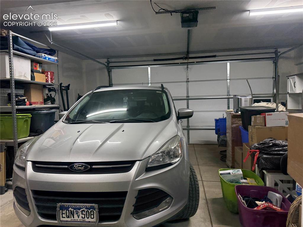Image 32 of 37: drywalled lights garage door opener