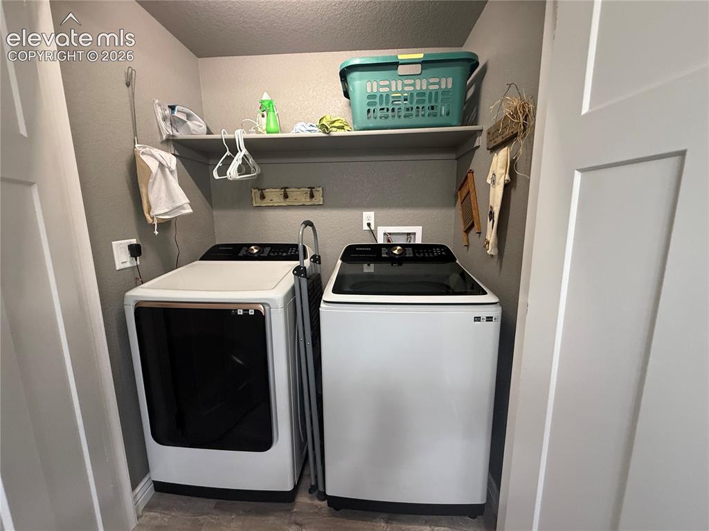Image 34 of 37: lower level laundry off the bathroom